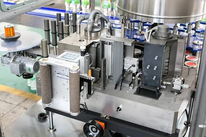 Labelling machine on a plastic bottle packaging line